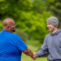Two players shake hands after game